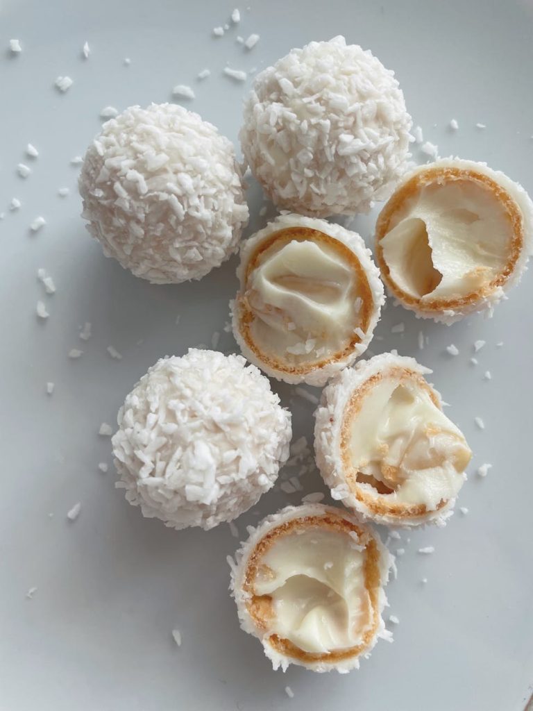 Close-up of sweet coconut cream pralines, a delightful treat for dessert lovers.