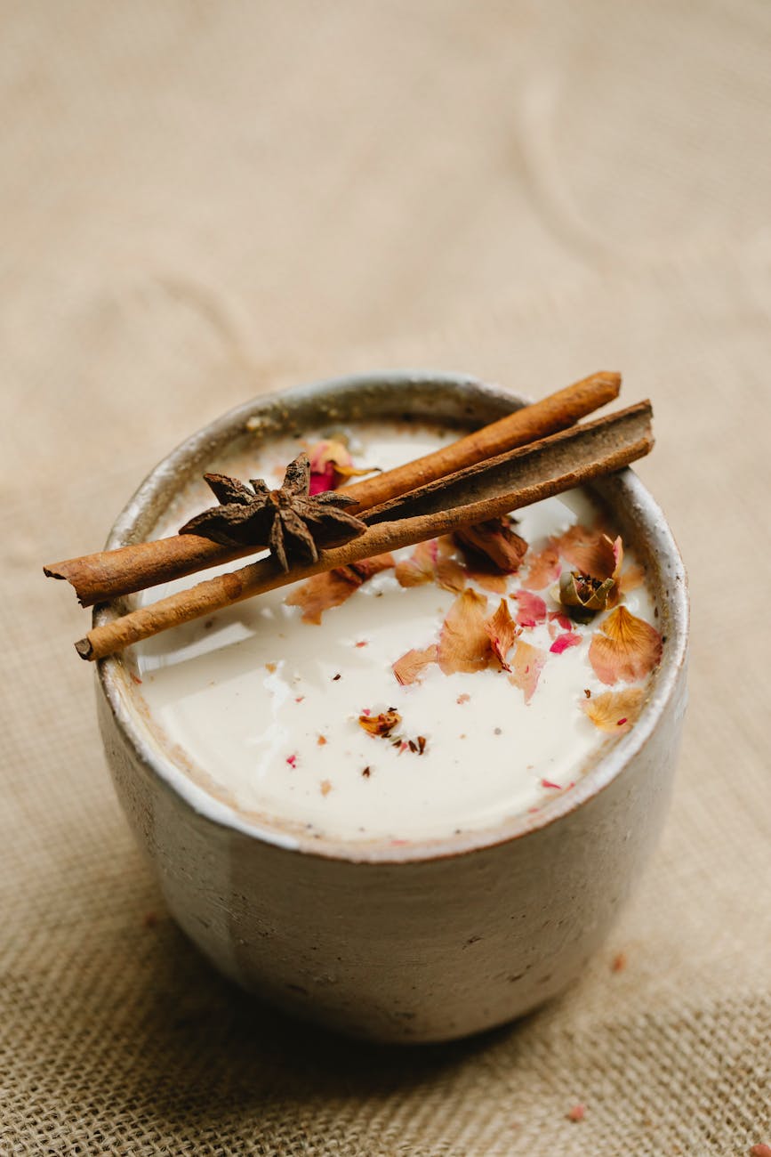 Delicious chai tea garnished with cinnamon sticks and star anise, offering a warm aromatic experience.